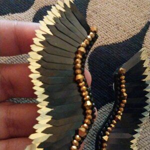 Black and gold Angel earings with beautiful details the gold is beaded jewels